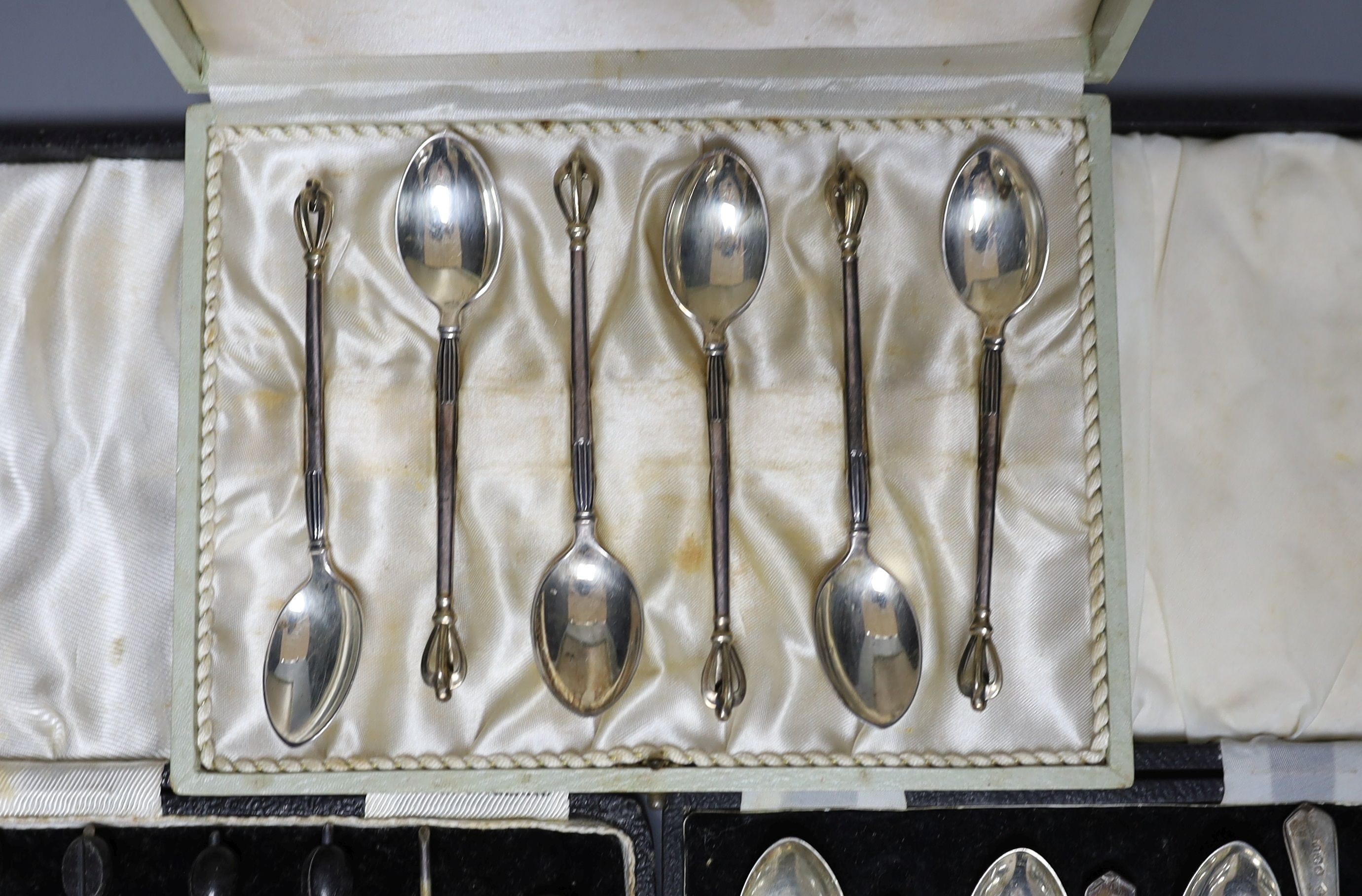 Two cased sets of six silver coffee spoons and a similar Danish sterling set.